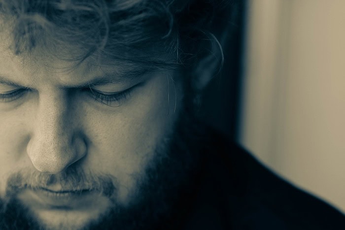 Close up portrait of man looking dejected.