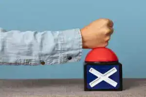 A hand pressing down on a red cancel button.